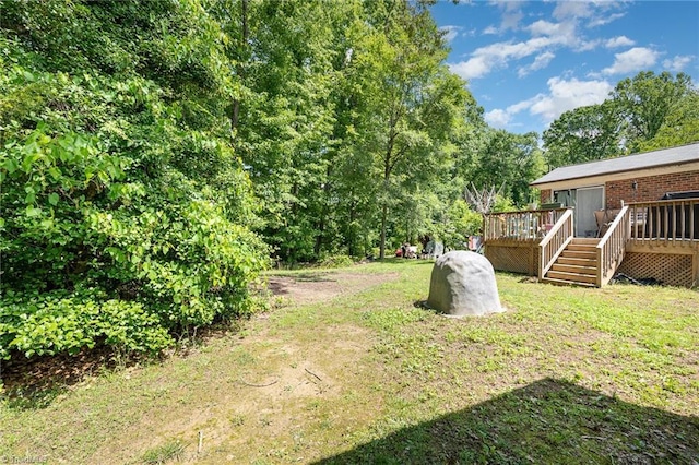 6215 Russwood Dr, Pleasant Garden, NC 27313 - view of green lawn featuring a wooden deck