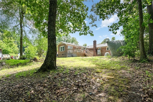 6215 Russwood Dr, Pleasant Garden, NC 27313 - view of yard with a wooden deck and stairway