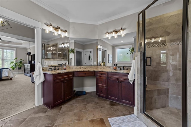 601 Rachel Smothers Dr, Greensboro, NC 27455 - ensuite bathroom with ornamental molding, plenty of natural light, a shower stall, double vanity, and tile patterned floors