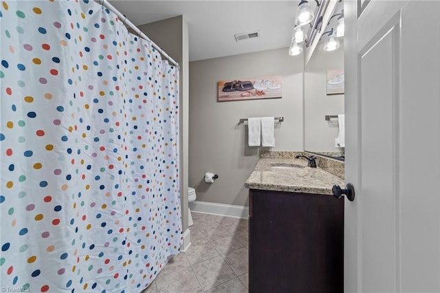 601 Rachel Smothers Dr, Greensboro, NC 27455 - bathroom with toilet, tile patterned floors, vanity, baseboards, and curtained shower