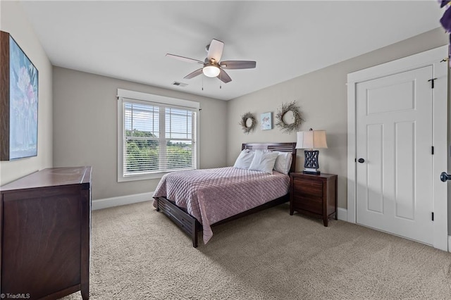 601 Rachel Smothers Dr, Greensboro, NC 27455 - bedroom with light colored carpet, baseboards, and ceiling fan