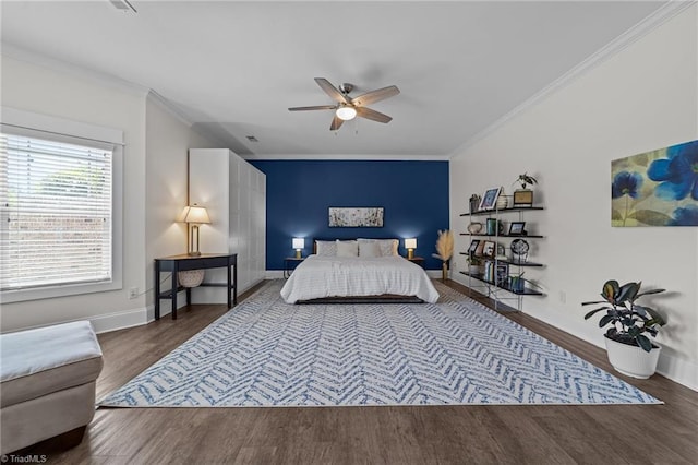 601 Rachel Smothers Dr, Greensboro, NC 27455 - bedroom featuring wood finished floors, crown molding, baseboards, and ceiling fan