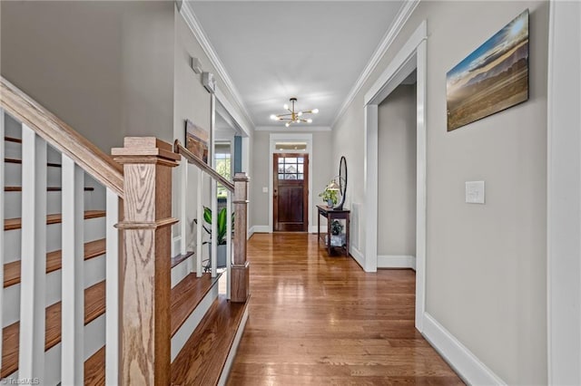 601 Rachel Smothers Dr, Greensboro, NC 27455 - foyer featuring crown molding, stairway, a chandelier, wood finished floors, and baseboards