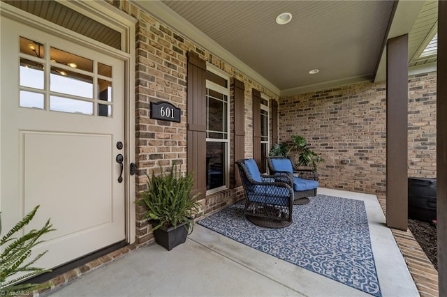 601 Rachel Smothers Dr, Greensboro, NC 27455 - property entrance featuring covered porch and brick siding