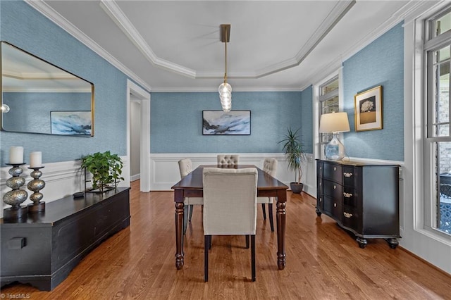 601 Rachel Smothers Dr, Greensboro, NC 27455 - dining area featuring wood finished floors, a raised ceiling, wainscoting, and crown molding