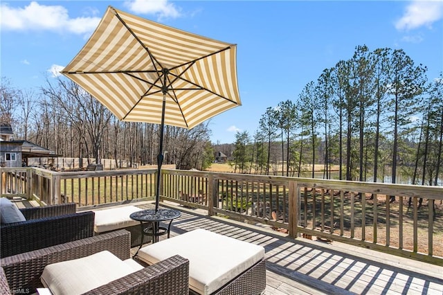 wooden deck featuring outdoor lounge area