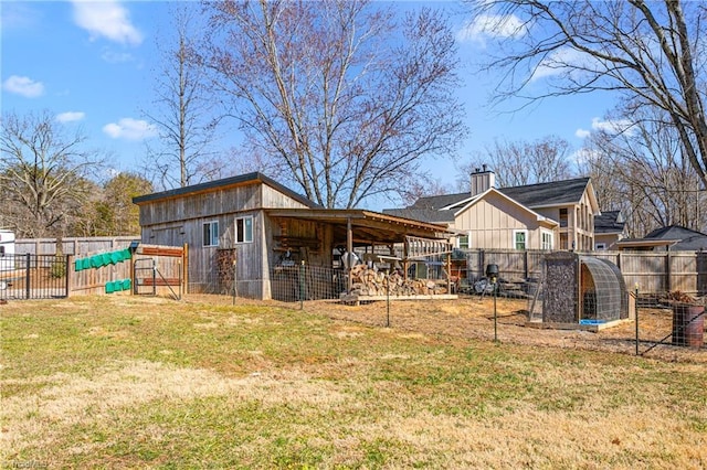 view of outdoor structure with a fenced backyard and an outdoor structure