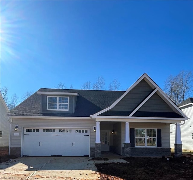 craftsman-style home with a garage and a porch