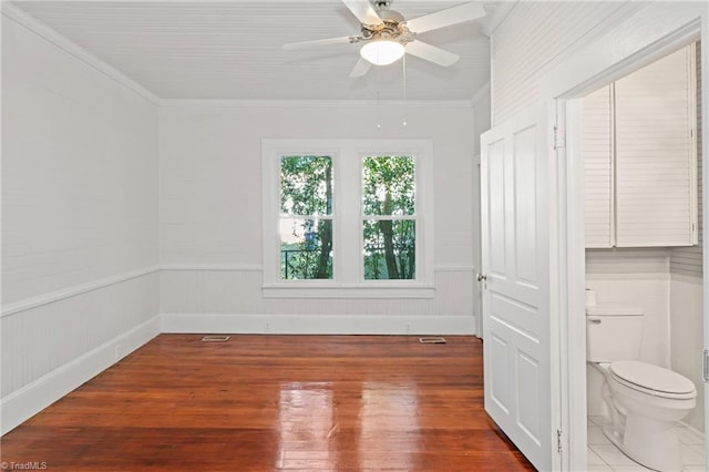 spare room with ceiling fan, hardwood / wood-style floors, and ornamental molding