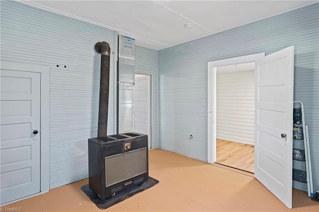 interior space with heating unit and hardwood / wood-style flooring