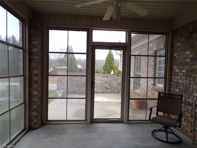 sunroom with a ceiling fan