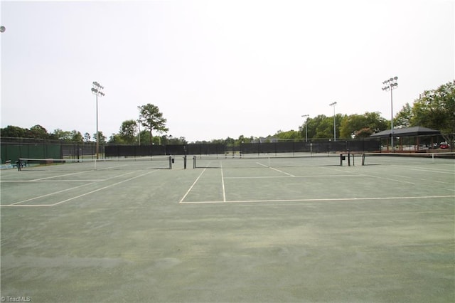 view of tennis court with fence