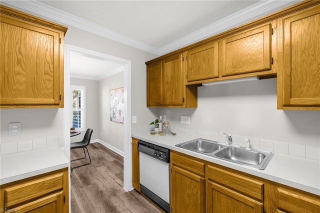 kitchen featuring crown molding, dark wood-style floors, light countertops, a sink, and dishwasher