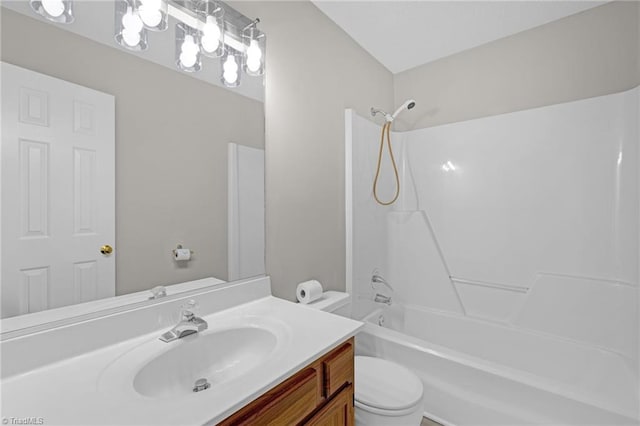 full bathroom with vanity, shower / bathing tub combination, and toilet