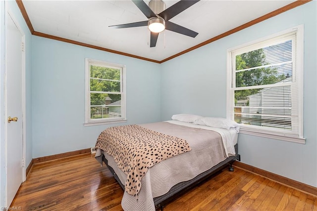 1607 Belmont St, Burlington, NC 27215 - bedroom with hardwood / wood-style flooring, multiple windows, crown molding, and ceiling fan