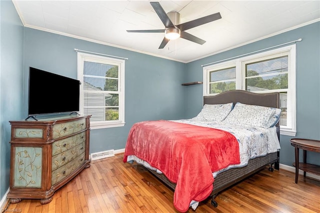 1607 Belmont St, Burlington, NC 27215 - bedroom featuring crown molding, light wood-type flooring, multiple windows, and ceiling fan