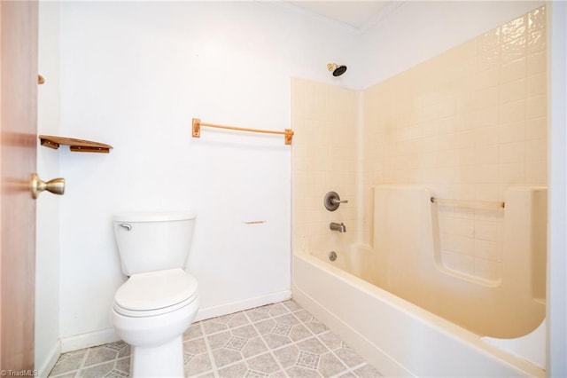 bathroom with tile patterned floors, toilet, and bathing tub / shower combination