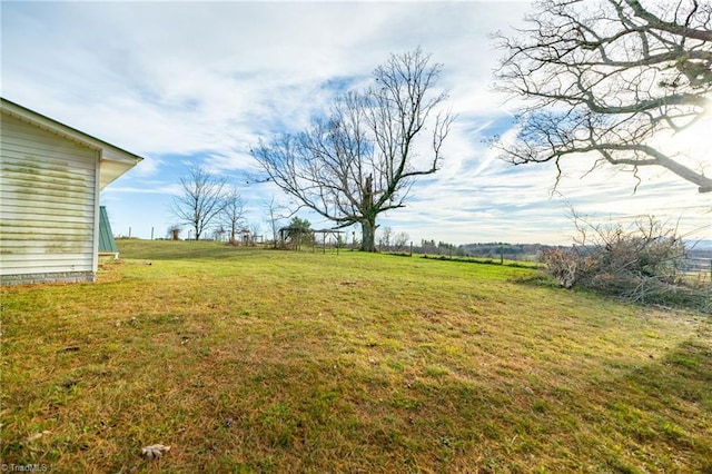 view of yard with a rural view