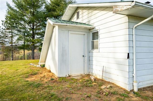 view of outbuilding with a lawn