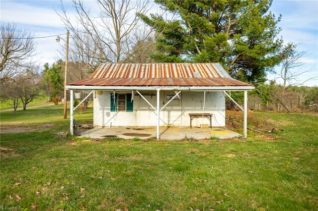 view of outbuilding with a lawn