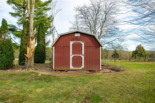 view of outbuilding with a yard