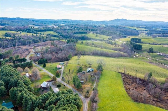 birds eye view of property featuring a mountain view and a rural view