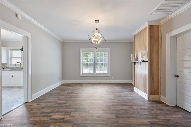 unfurnished dining area featuring ornamental molding, dark hardwood / wood-style floors, and sink