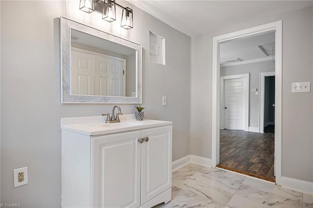 bathroom with crown molding and vanity