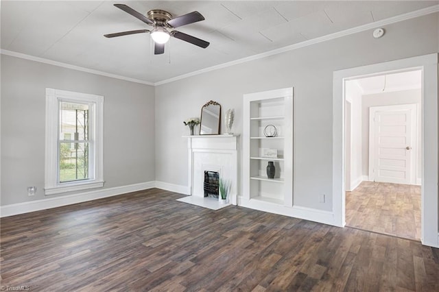 unfurnished living room with dark hardwood / wood-style flooring, ornamental molding, built in features, and ceiling fan