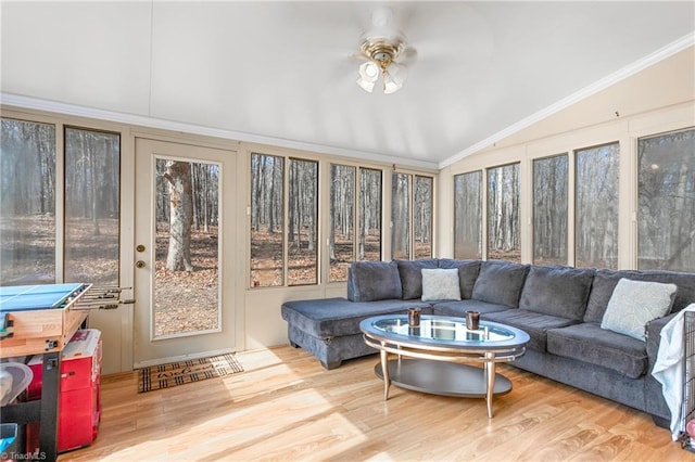 sunroom / solarium featuring vaulted ceiling and ceiling fan