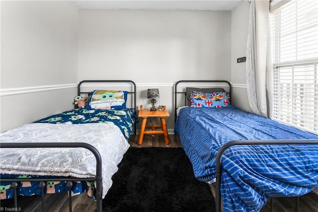 bedroom with hardwood / wood-style floors