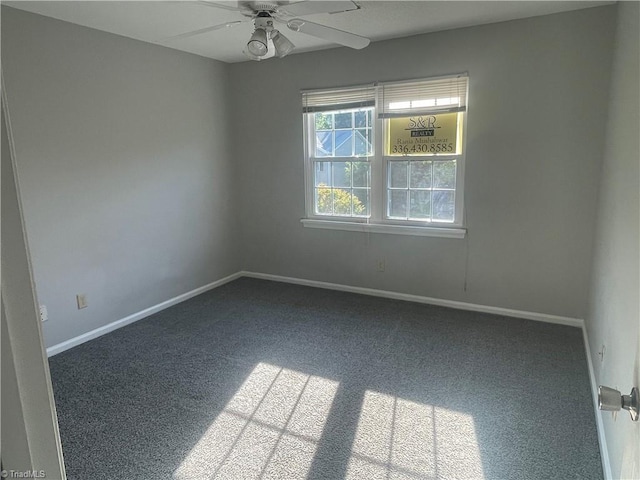 unfurnished room with baseboards, carpet flooring, and ceiling fan