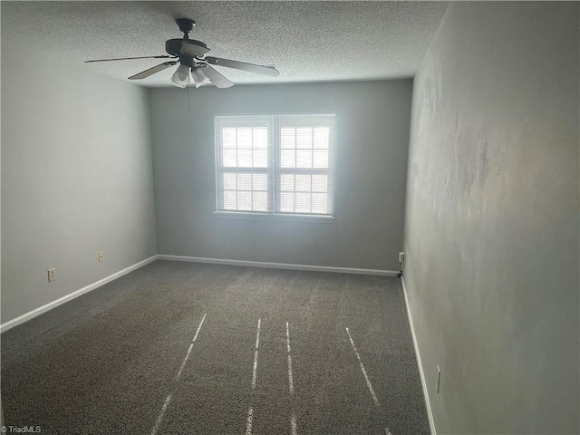 unfurnished room featuring baseboards, a textured ceiling, ceiling fan, and carpet