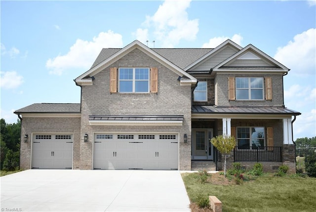 craftsman house featuring a porch, a garage, and a front yard