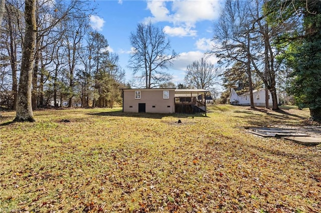 view of yard with a wooden deck