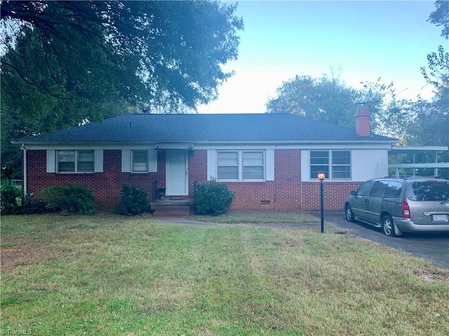 ranch-style house with a front yard