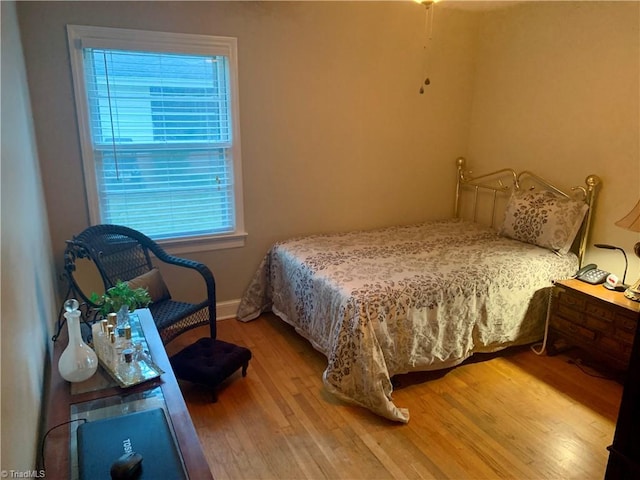 bedroom featuring wood-type flooring