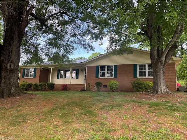ranch-style house with brick siding, a front yard, and crawl space