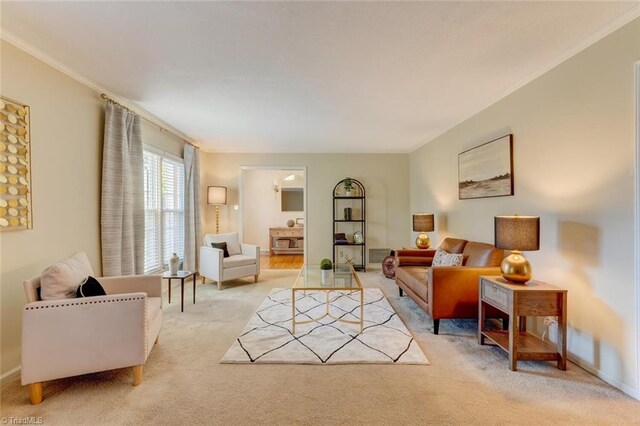 carpeted living room featuring ornamental molding