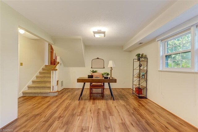 office space with light hardwood / wood-style flooring