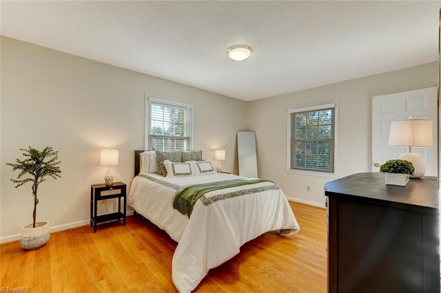 bedroom featuring light wood-type flooring