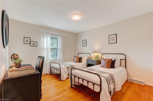 bedroom with light wood-type flooring