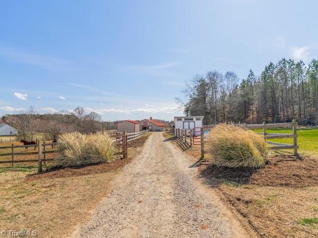 view of street featuring a rural view and driveway