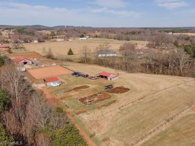 birds eye view of property with a rural view