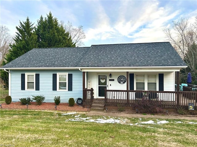 ranch-style home with a front yard and a porch