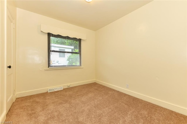 1017 Logan St Unit 2, Greensboro, NC 27406 - spare room with light carpet and baseboards