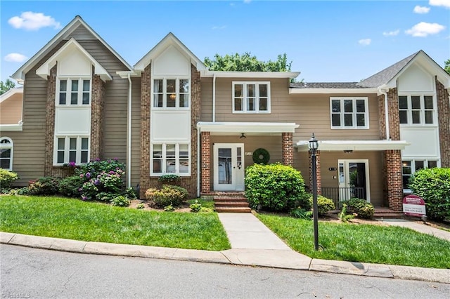 4548 Fernhaven Cir, Winston-Salem, NC 27104 - view of front of home with brick siding and a porch