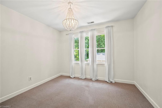 4548 Fernhaven Cir, Winston-Salem, NC 27104 - spare room with a chandelier, carpet floors, and baseboards