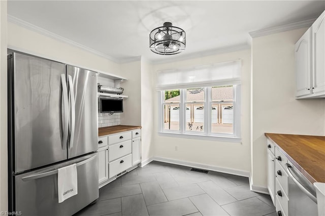 4548 Fernhaven Cir, Winston-Salem, NC 27104 - kitchen with freestanding refrigerator, wood counters, open shelves, white cabinetry, and baseboards