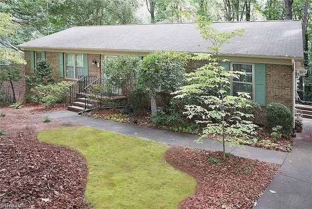 ranch-style house with brick siding